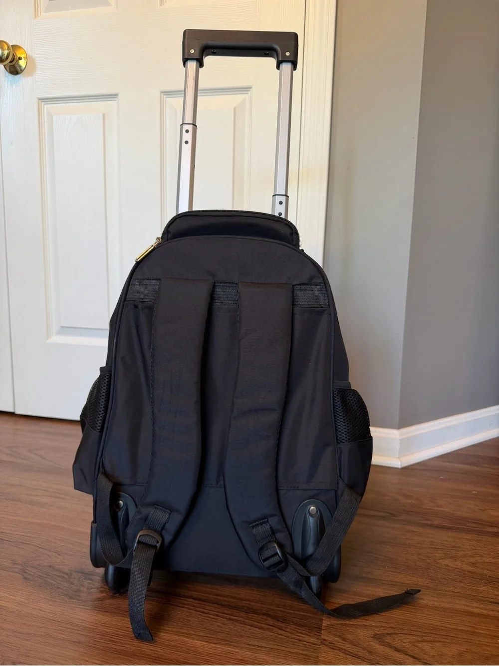 Black Everyday Rolling Travel Backpack with Multiple Pockets